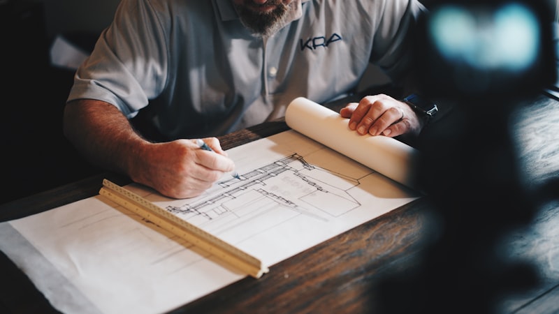 Reviewing construction drawings at the drafting table