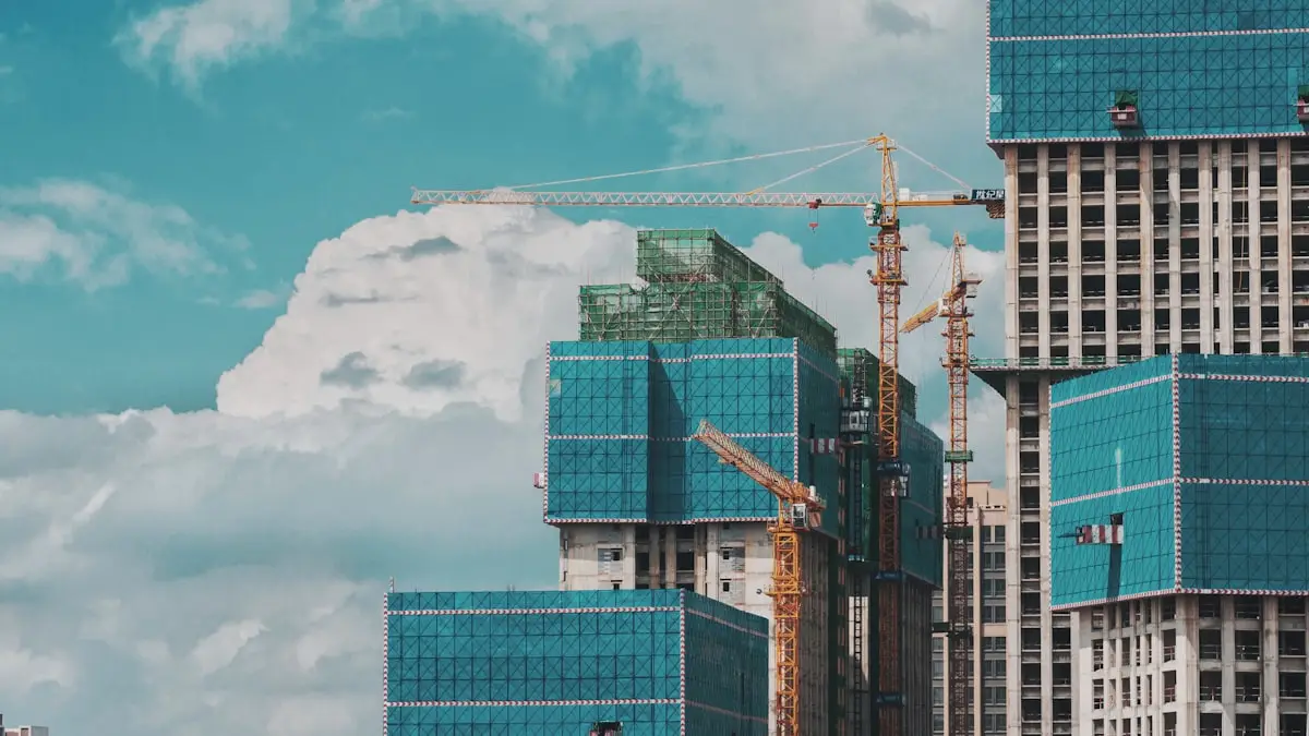 High-rise commercial block under construction with tower cranes